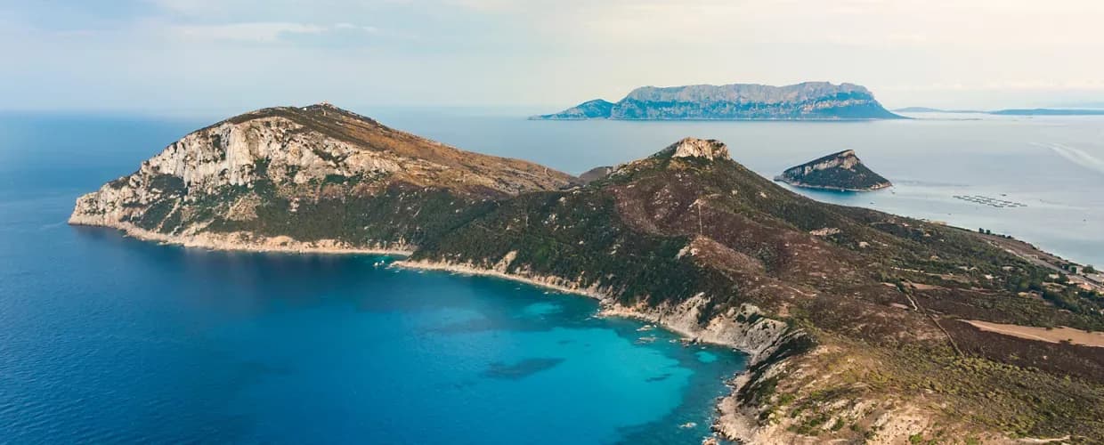 Capo Figari hiking trail Semaforo lighthouse Marconi radio station Golfo Aranci Sardinia trekking route Mediterranean views wireless telegraphy historic site