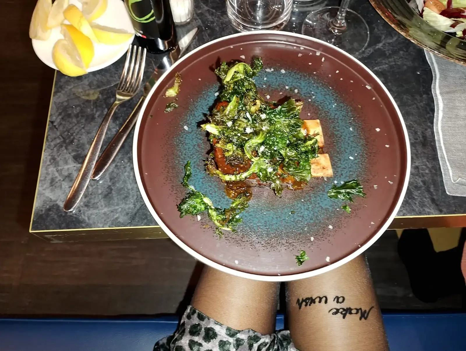 Fancy food with kale, tofu, and lemon.