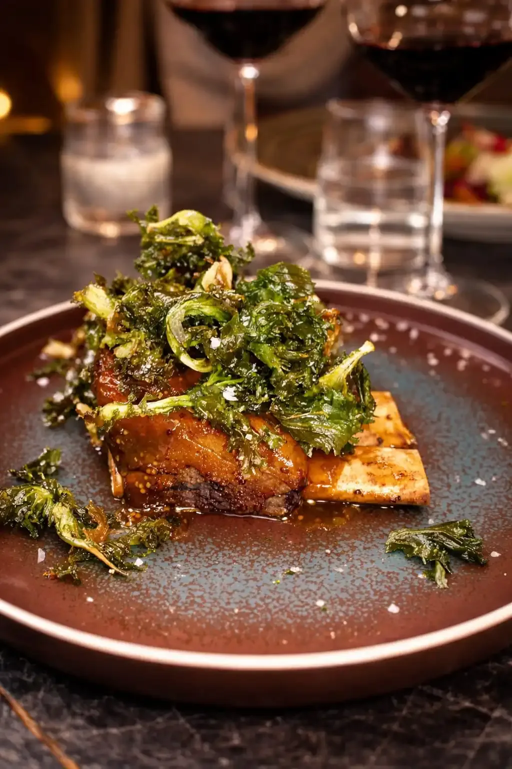 Braised short ribs with kale and red wine.
