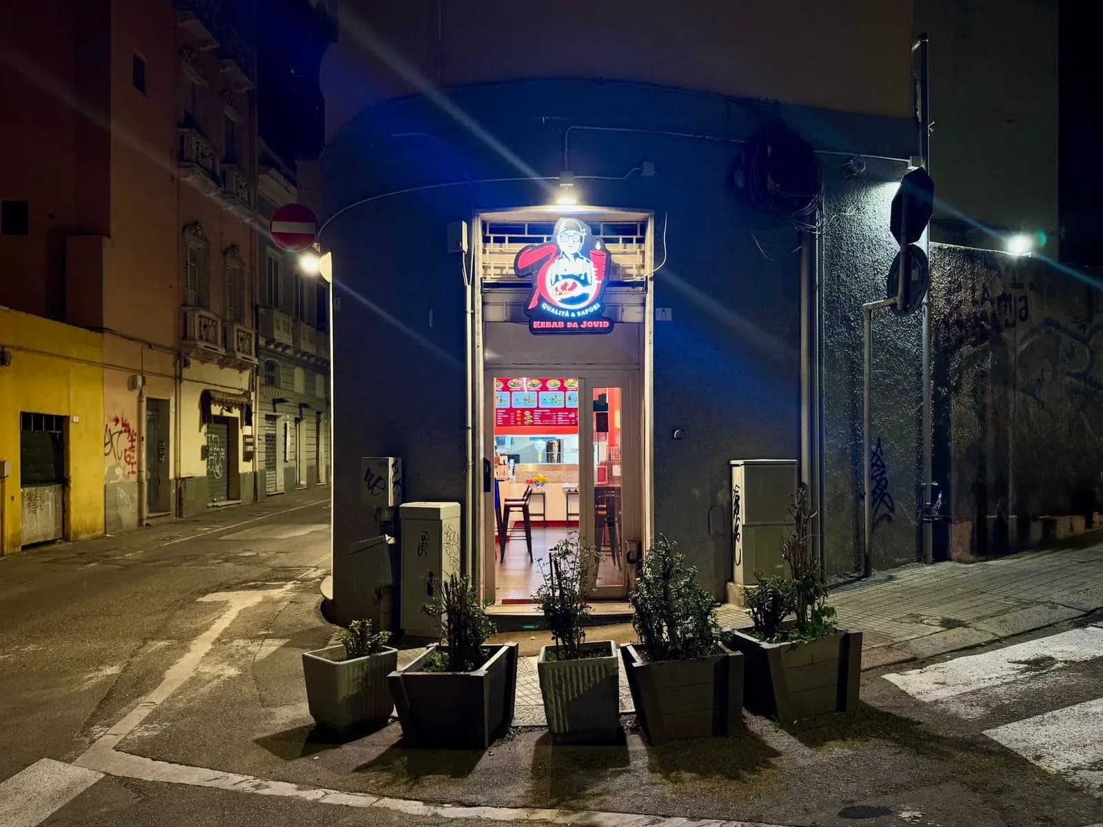 Kebab Da Jovid storefront at night, European city street