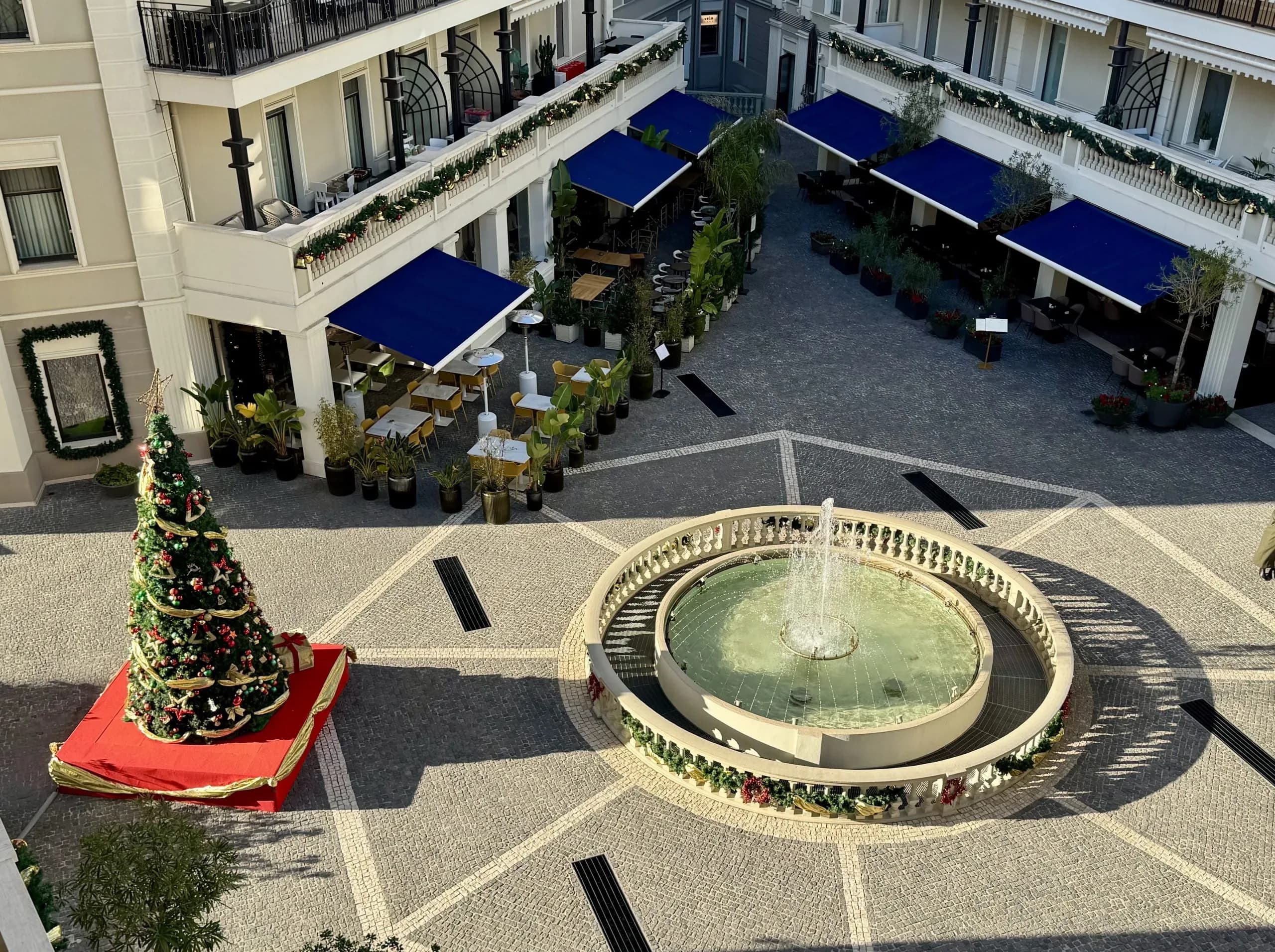 Courtyard with Christmas tree and fountain, overhead view.