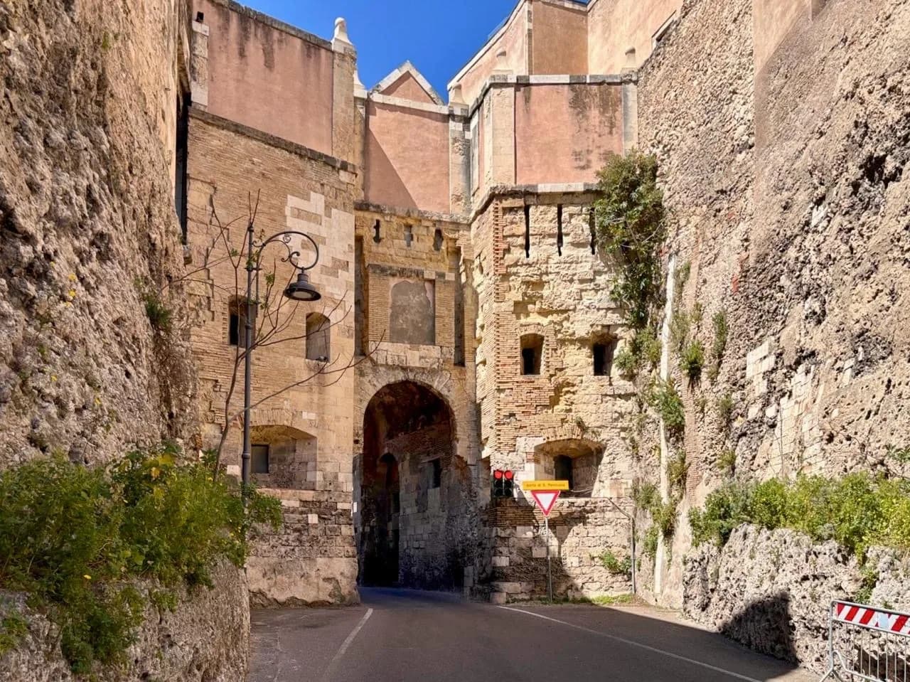 Cagliari, Sardinia: Ancient stone gateway and road.