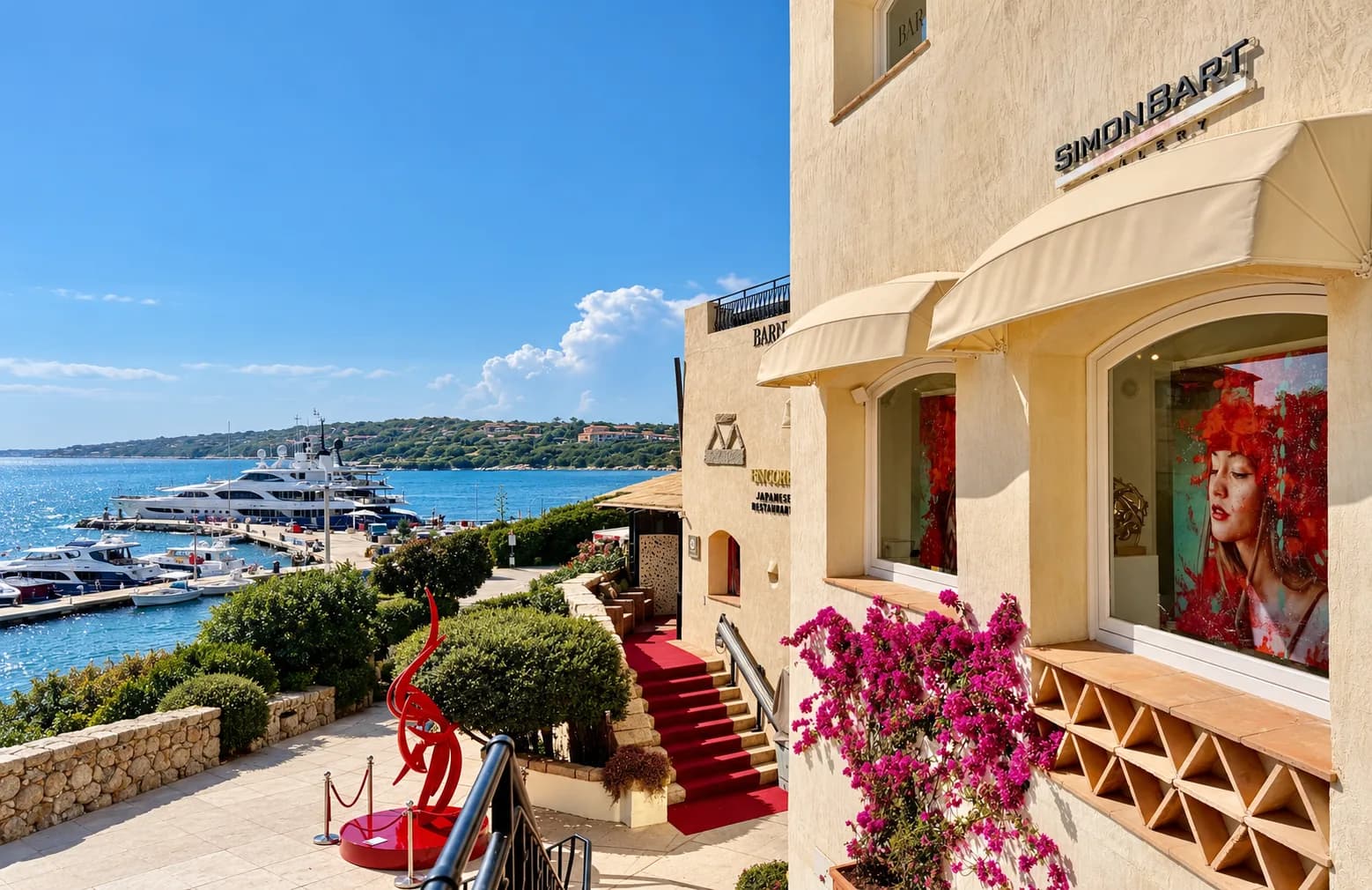 SimonBart Gallery front with portrait in the window, red-carpeted steps and a red sculpture above Porto Cervo marina