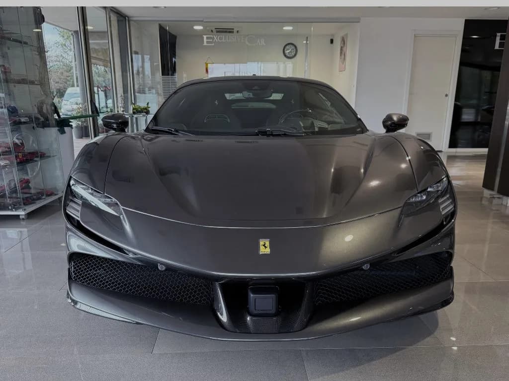 Grey Ferrari SF90 in the Exclusive Car showroom in Olbia