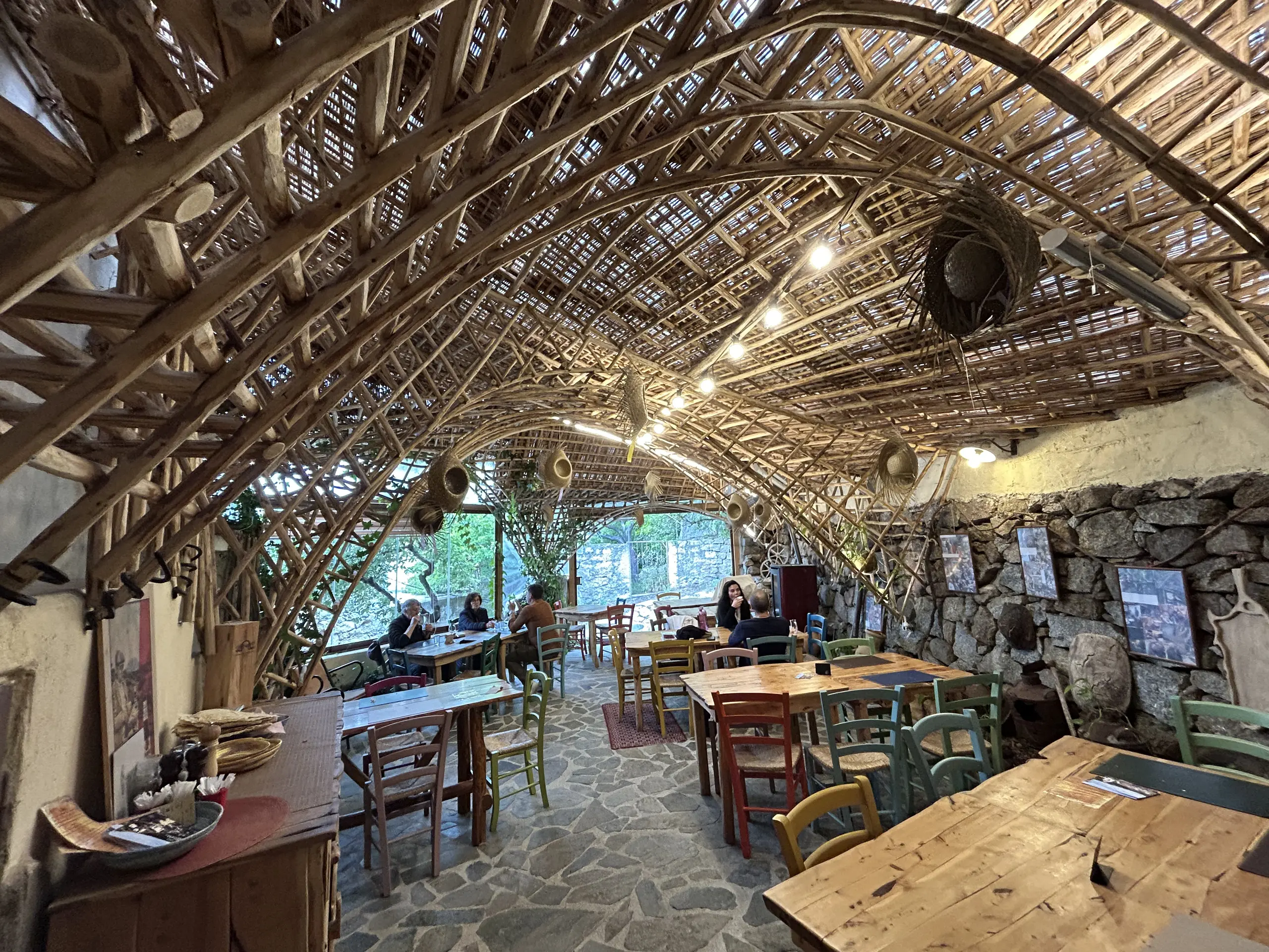 Rustic café with bamboo arched ceiling and tables