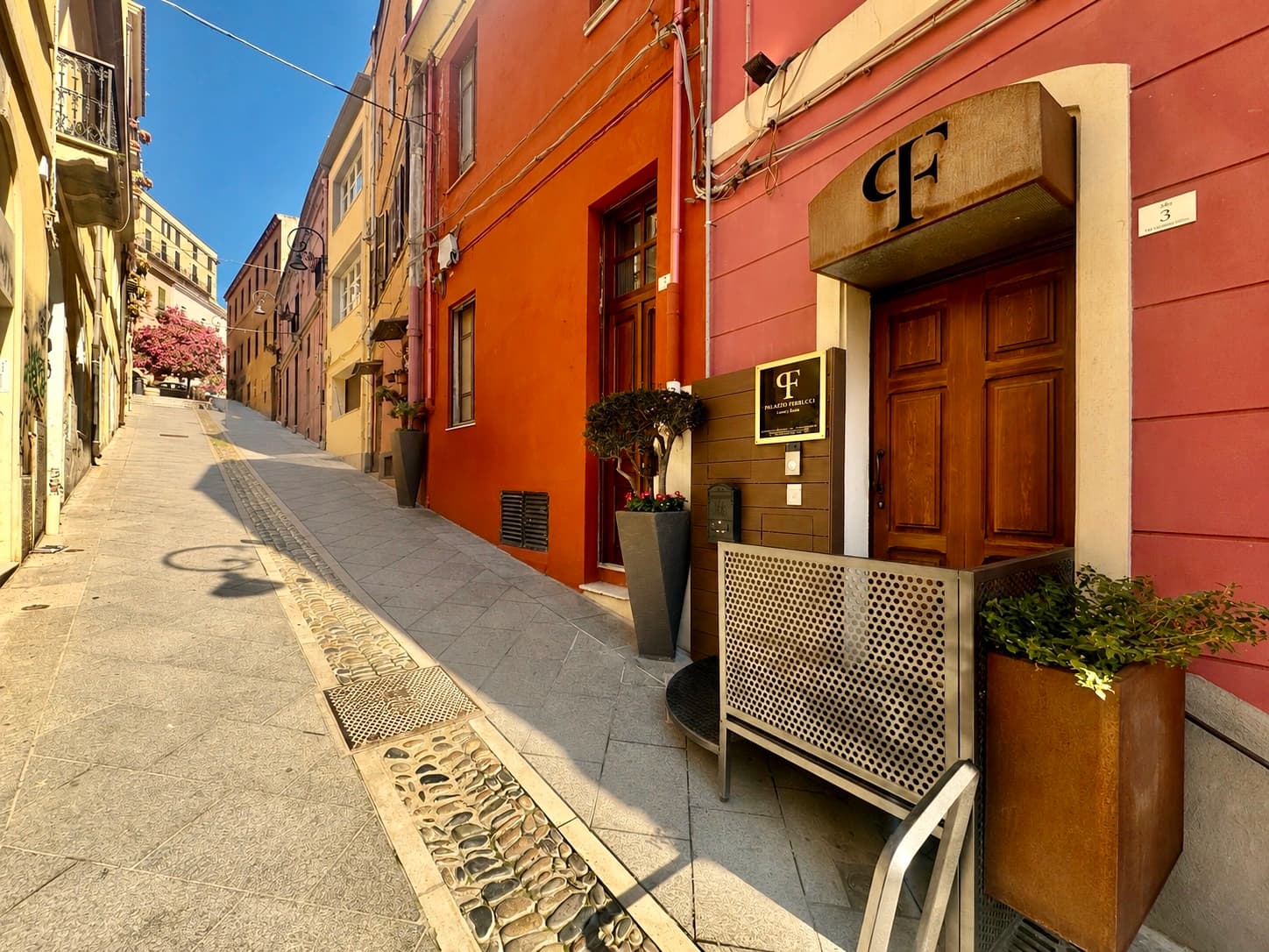 Colorful narrow street with boutique entrance and wooden door